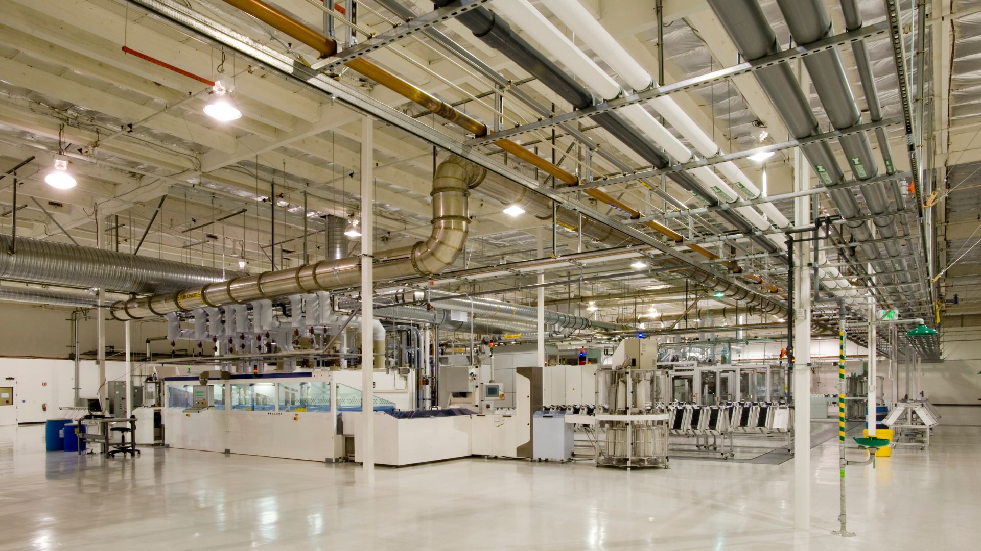 A sprawling industrial complex with numerous pipes and machinery.